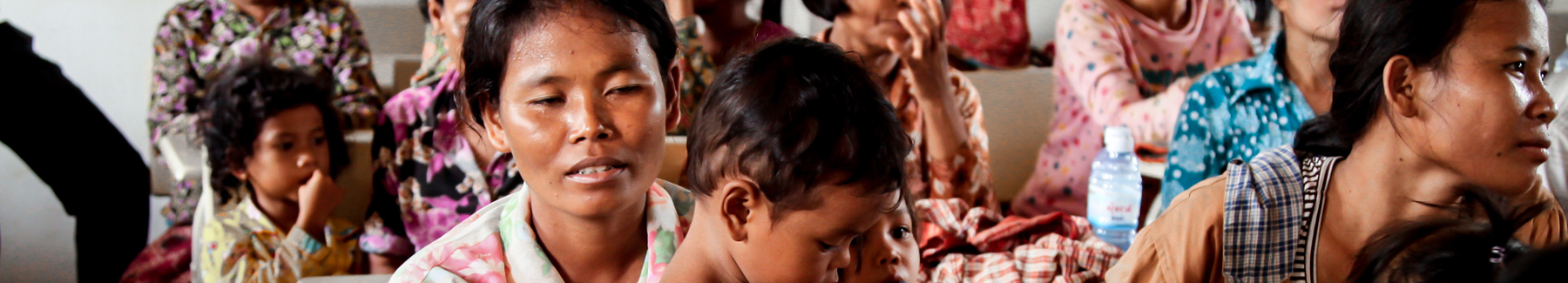 Women participate in a reproductive health voucher program.